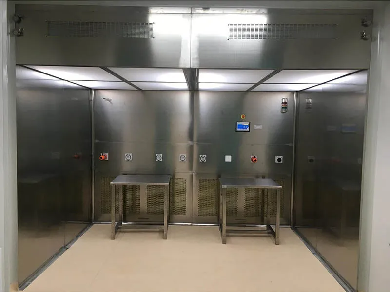 Clean room weighing cover installed within a prefabricated cleanroom bay, adjacent to clean room partition panels and ceiling grid